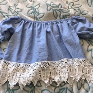 A blue laced loose crop top.